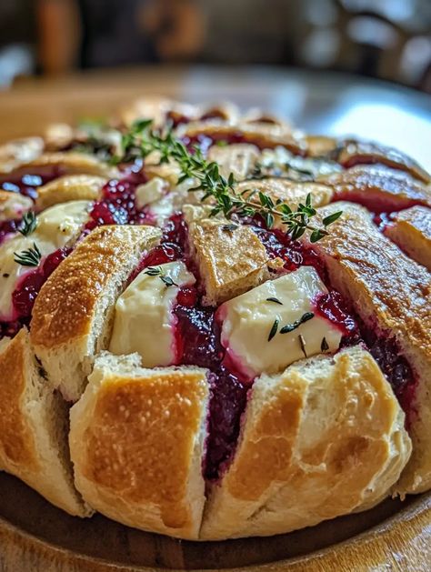 Looking for a delicious, crowd-pleasing appetizer for your holiday gatherings? Cranberry Brie Sourdough Pull-Apart Bread is a mouth-watering choice that Brie Sourdough Bowl, Sourdough And Brie, Sourdough With Brie, Sour Dough Brie Cranberry, Dutch Oven Appetizers, Brie Stuffed Sourdough, Brie Pull Apart Bread Recipe, Appetizers With Sourdough Bread, Brie Cranberry Pull Apart Bread