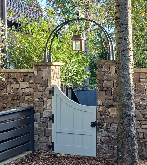 Adorned with natural gas lantern Country House Gate Entrance, Limestone Gate Entrance, Deer Fence Garden Gate, Exterior Gas Lantern Lighting, Log Entrance Gate, Garden Entrances, Driveway Lights, Lantern Garden, Driveway Lighting