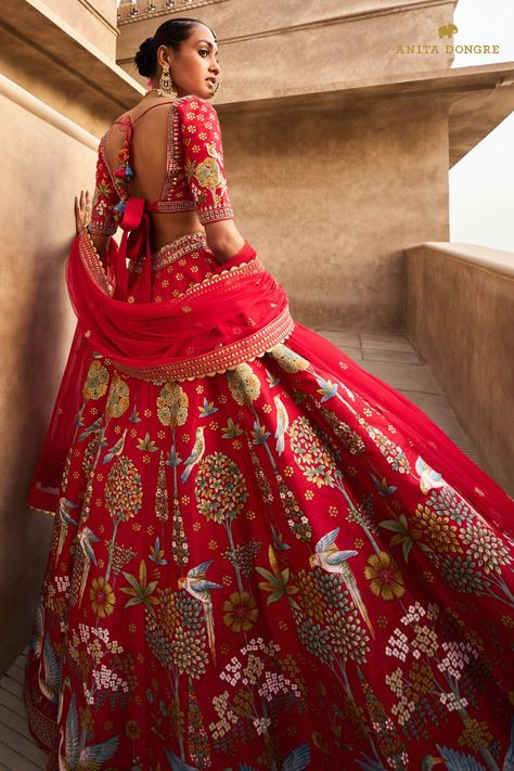 Timeless silhouettes for modern Indian weddings in elegant motifs & handcrafted details.

Our Visvam Lehenga in red, painted with Pichhwai art by master artisans blends craft and couture. Multicolour bird motifs cover the raw silk, and the choli makes a stylish statement. The lehenga comes with pockets.
Customisation Available For:
Choli sleeves and Choli length
Lehenga length
Fabric Color Ghagra Design, Latest Bridal Lehenga Designs, Bridal Lehenga Designs, Printed Lehenga, Latest Bridal Lehenga, Lehenga Red, Indian Bride Outfits, Bridal Attire, Bridal Applique