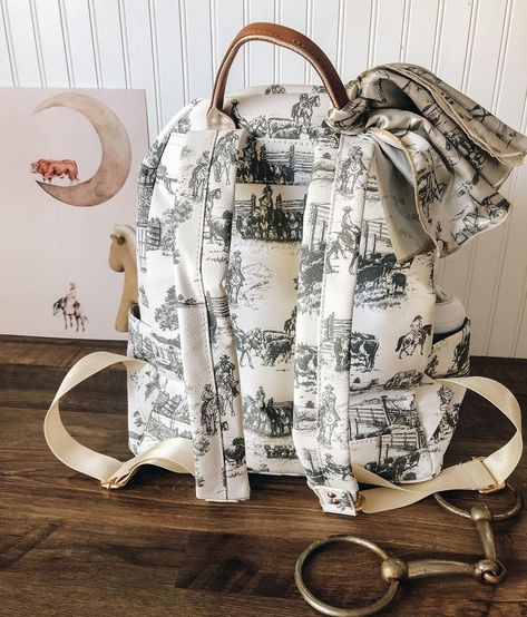 Mama’s don’t let your cowboys grow up to be babies 🖤 The diaper bag we’ve all been dreaming of 🤍 If you’re not in the market for a… | Instagram Western Diaper Bag, Laptop Carrier, Baby Necessities, Baby Brother, Cowboy And Cowgirl, Baby Grows, Future Kids, Baby Fever, Baby Nursery