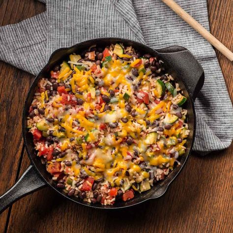 Zucchini combined with black beans, fire roasted tomatoes and rice for an easy skillet meal Black Bean And Rice, Spicy Zucchini, Zucchini Skillet, Zucchini Rice, Bean And Rice, Bean Rice, Ready Set Eat, Black Beans And Rice, Easy Skillet Meals