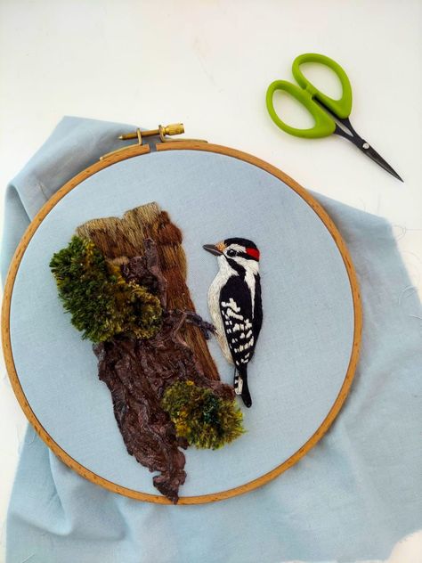 Embroidering moss to add as finishing details to a 3D Downy woodpecker embroidery. | Megan Zaniewski | James Quinn · A Gentle Sunlight Megan Zaniewski, Calendar Embroidery, Moss Embroidery, Gothic Embroidery, Downy Woodpecker, Bird Embroidery, Needlework Embroidery, Thread Painting, Animal Embroidery