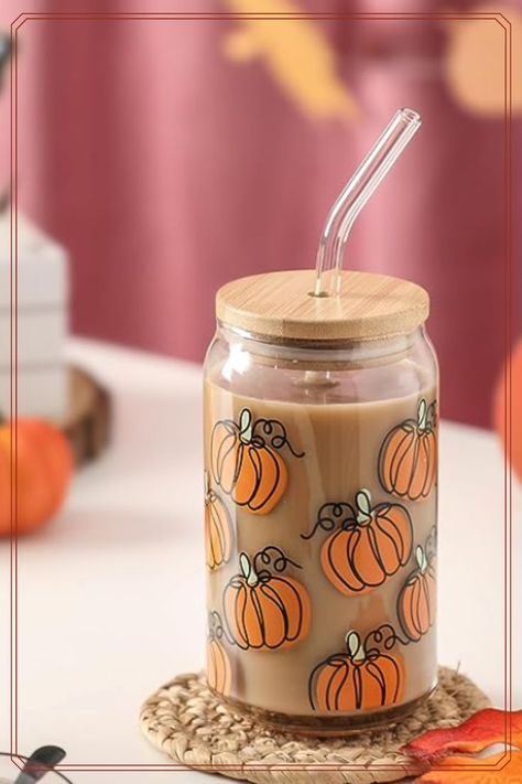 🎃 Sip in Style with Our Whimsical Pumpkin Glass Cup Set! 🎃 Add a dash of enchantment to your sips with our charming can-shaped glass cup, complete with a natural bamboo lid and a crystal-clear glass straw. 🍂🥤 🌟 These whimsical orange pumpkins will bring a touch of magic to your every sip, making your drink a delightful experience. 🧡✨ #PumpkinCup #EcoFriendlyLiving #AutumnSips #WhimsicalMagic #PinterestFinds Fall Iced Coffee, Pumpkin Cups, Glass Cup Set, Halloween Cans, Eco Friendly Living, Glass Straws, Pumpkin Orange, Drinking Cup, Thanksgiving Gifts