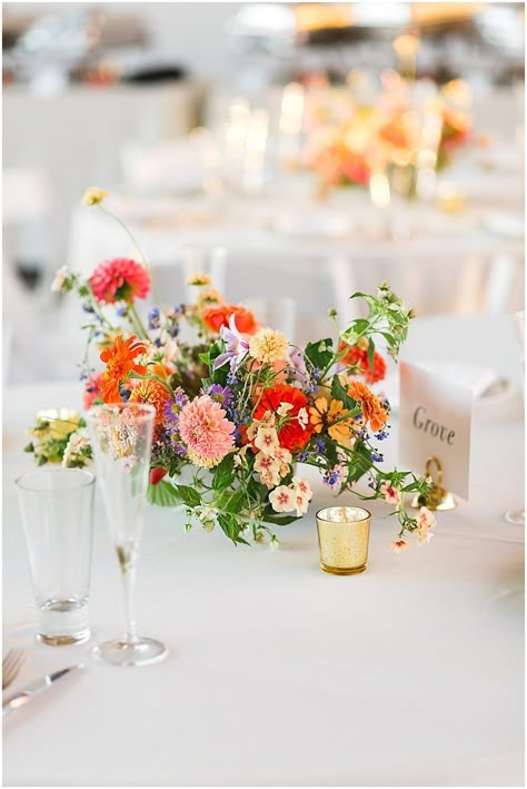 Colorful Table Flower Arrangements, Wild Flower Altar Arrangement, Wildflower Centrepiece Wedding, Wildflower Wedding Center Piece, Bright Flower Centerpieces Wedding, Wildflower Wedding Centerpiece Round Table, Colorful Summer Centerpieces, Floral Wedding Centerpieces Low, Table Meadows Wedding