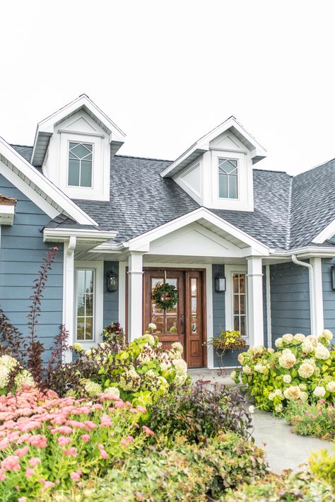 A beautiful house with the perfect blue paint color. SW-6236 Gray's Harbor Blue House White Trim Wood Accents, Light Blue Siding House, Blue House Siding Ideas Exterior, Blue And White Craftsman House, Blue Cottage Exterior White Trim, Blue Roof House Colors Exterior Paint, Light Blue House Exterior Colour Schemes, Wedgewood Blue House Exterior, Blue Cottage Exterior