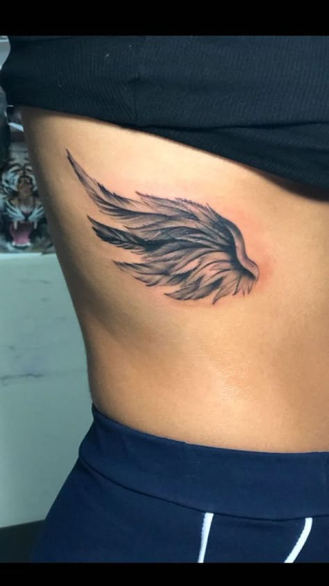 rib-cage-angel-wing-tattoo-angel-and-devil-tattoo-black-top-black-pants Wing Tattoo On Shoulder, Wing Tattoos On Wrist, Angel Wing Tattoo, Heart With Wings Tattoo, Wing Tattoos On Back, Wing Tattoo Men, Dragons Tattoo, Wing Tattoo Designs, Tattoo Zeichnungen