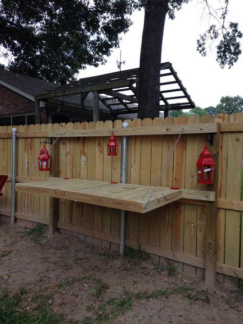 Fold down table attached to privacy fence build by my husband. Backyard Altar, Fence Bar, Fence Table, Patio Covering, Fence Extension, Firefighters Wife, Patio Plan, Backyard Creations, Fold Down Table