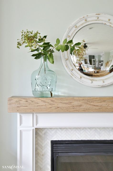 DIY Wood Beam Mantel marble backsplash with SW sea salt wall color Coastal Fireplace Ideas, Beach House Fireplace, Beach Fireplace, Farmhouse Paint Colors Interior, Coastal Family Rooms, Coastal Fireplace, Design Camino, Appartment Decor, Fireplace Mantle Decor