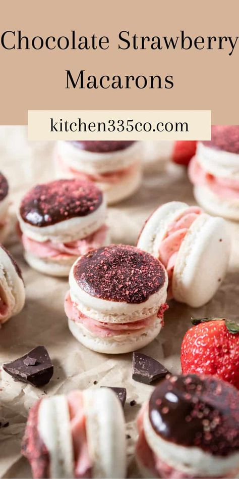 Chocolate Strawberry Macarons have a classic french macaron shell that has been dipped in chocolate and crushed freeze dried strawberries and filled will strawberry American buttercream. They have a delicious balance of flavors and textures that will make you fall in love with macarons! Strawberries And Cream Macarons, Valentine Macaron Flavors, Macaron Flavors Recipe, Fun Macaron Flavors, Unique Macaron Flavors, Macrons Recipes Flavors, Macaron Flavors Ideas, Thanksgiving Macarons, Summer Macarons