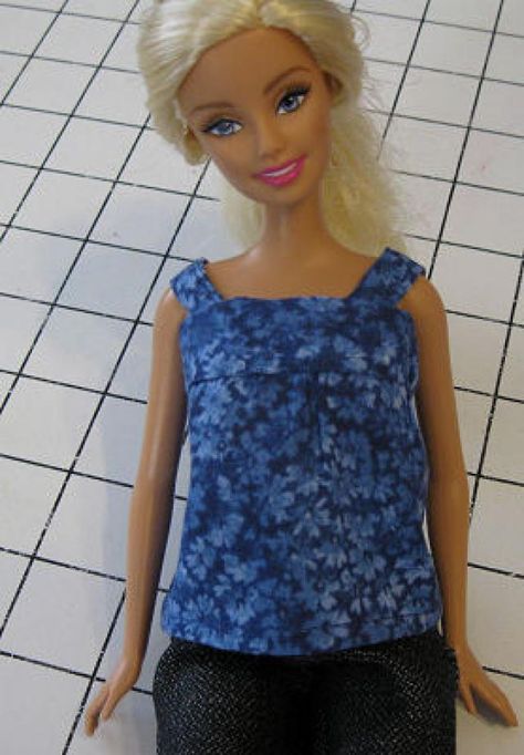 Barbie wearing the blouse made from this free Barbie shirt pattern - Debbie Colgrove, Licensed to About.com Barbie Doll Clothes Patterns, Barbie Shirt, Free Printable Sewing Patterns, Barbie Doll Patterns, Accessoires Barbie, Free Barbie, Barbie Dress Pattern, Sewing Barbie Clothes, Barbie Sewing Patterns