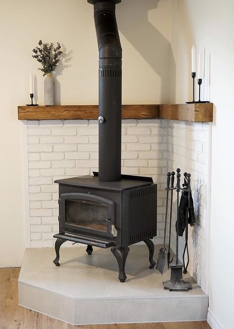 Mantel Around Wood Burning Stove, Corner Potbelly Fireplace, Tile Around Wood Burning Stove, Living Room Designs Wood Stove, Cabin Stove Wood Burning, Tile Pellet Stove Surround, Free Standing Wood Burning Stove With Mantle, Gas Stove Fireplace Freestanding, Mantel Behind Wood Stove