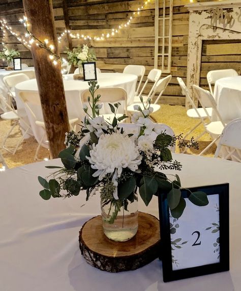 Mason Jar Flowers Centerpiece, Black And White Mason Jar Centerpieces, White Flowers In Mason Jars, Simple Wedding Centerpieces Mason Jars, White Flowers Mason Jar Centerpiece, Eucalyptus Centerpiece Mason Jar, Rustic Eucalyptus Centerpiece, Mason Jar With Eucalyptus, White Flower And Eucalyptus Centerpieces