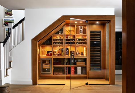 20 Ingenious Wine Storage Areas Under the Stairs Under Stairs Wine Cellar, Contemporary Wine Cellar, Room Under Stairs, Liquor Storage, Mclean Virginia, Steel Frame Doors, Frameless Glass Doors, Contemporary Staircase, Home Wine Cellars