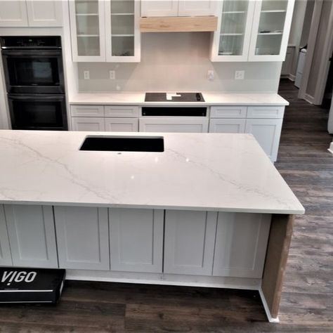 Calacatta Lincoln quartz countertops offer a timeless and sophisticated appeal that transforms any kitchen or bathroom into a luxurious space. This stunning material is known for its striking white background adorned with elegant, wide gray veining.

https://mountainempirestoneworks.com/color-spotlight-calacatta-lincoln-quartz/ White Grey Quartz Countertops, White Kitchen Countertops Quartz, Neutral Quartz Kitchen Countertops, Grey Quartz Countertops, Calacatta Lincoln, Color Spotlight, White Kitchen Countertops, Light Gray Cabinets, Quartz Kitchen Countertops