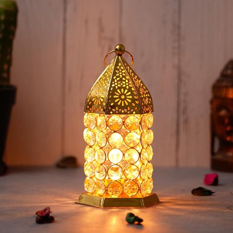 WebelKart Premium Crystal Lantern Shape Tealight Candle Holder for Home Decor |Tealight Holder for Diwali Decor (6.49" Inches Gold) Table Candle Stand About product : ✔️MEASUREMENTS/MATERIAL: Each one measures 8.66" x 3.14" , and made of metal and glass ✔️USE: These are perfect for adding a decorative touch to any room's decor. Perfect for everyday use, wedding, events, aromatherapy,Spa, Reiki, Meditation, Bathroom setting ✔️BENEFITS: They can accent your home or office for the right decor. ... Meditation Bathroom, Crystal Lantern, Table Candle, Diwali Decor, Reiki Meditation, Candle Table, Tealight Candle Holder, Gold Table, Tealight Candle