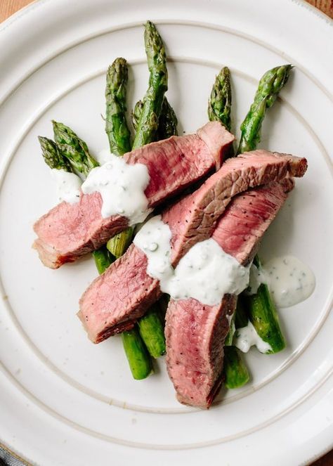 Here's a super quick dinner for your springtime arsenal — meaty sirloin tip steaks (sometimes called "charcoal steaks" or "knuckle steaks," depending on where you live) cook oh-so-quickly on a wire rack under the broiler, while the asparagus below soaks up all of the flavorful juices from the meat. An easy blender sauce with punchy chives and feta makes a great accompaniment. Super Quick Dinner, Steak Asparagus, Sirloin Tip Steak, Broiled Steak, Creamed Beef, Sirloin Tips, Sheet Pan Suppers, Cream Sauce Recipes, Ground Beef Recipes Easy