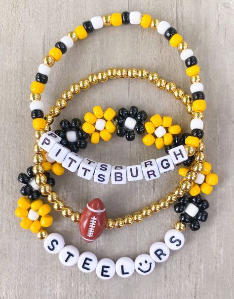 Super Bowl ready  Steelers Bracelet Set 💛🖤 Made with 4mm yellow and black seed beads, 18k gold filled beads and small 5mm square letters CARING TIPS FOR YOUR JEWELRY ⭐️Treat and store with care. ⭐️ For longevity, avoid exposing your jewelry to water. ⭐️ Avoid having direct contact with lotions, perfumes, sanitizers as these chemicals may cause discoloration of your jewelry. Steelers Bracelet, Pittsburgh Steelers Crafts, Cup Charms, Team Bracelets, Inspired Bracelets, Football Bracelet, Multiple Bracelets, Diy Jewlery, Sports Jewelry