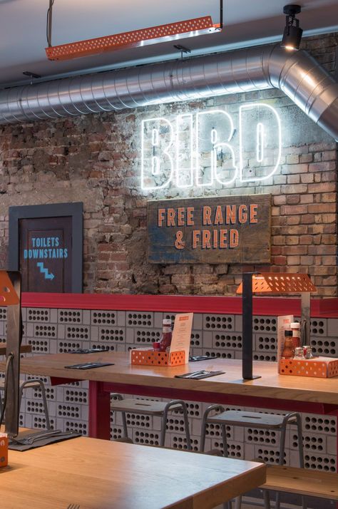 Brinkworth strips back London pub for fried chicken restaurant Industrial Restaurant Interior, Grey Interior Paint, Wings Restaurant, Fried Chicken Restaurant, Chicken Restaurant, Village Market, Chicken Shop, Industrial Restaurant, Glazed Brick