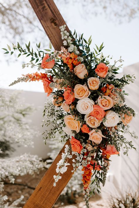 Hexagon wedding ceremony arch with coral florals and greenery (Venue: @terceroweddings // Design: @azflowerfix) #coral #wedding #peonies #roses #outdoorwedding #azwedding Coral And Terracotta Wedding, Coral Flower Bouquet Wedding, Hexagon Wedding Arch Terracotta, Wedding Flowers Design, Peach Arbor Flowers, Archway Wedding Flowers, Trending Wedding Flowers 2023, Wedding Arch Orange Flowers, Wedding Arch Orange