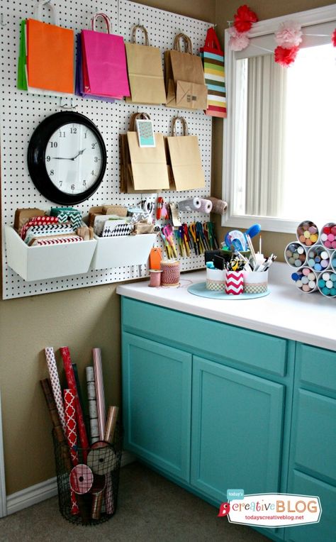 4. Craft Room Corner Wrapping Station. I love how this wrapping station fits perfectly into the corner of an entire craft room. The wire basket is a functional and beautiful solution to storing rolls of wrapping paper. Wrapping Paper Organization, Gift Wrap Storage, Gift Wrapping Station, Wrapping Station, Pegboard Organization, Dream Craft Room, Sewing Storage, Attic Storage, Wrapping Papers