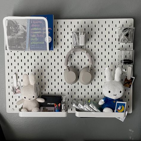 ikea skadis pegboard inspo, pegboard with headphones, books, film, keychains, electronic accessories, and miffy. polaroids add the cutest touch. room inspo, decor inspo, minimalist but also maximalist Skadis Pegboard Ideas, Ikea Skadis Pegboard Ideas, Pegboard Styling, Skadis Ikea Ideas, Ikea Pegboard Ideas, Room Inspo Decor, Skådis Ikea, Ikea Wall Storage, Skadis Pegboard