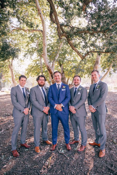 Navy Groom With Grey Groomsmen, Navy Blue Groom And Grey Groomsmen, Navy Groom Gray Groomsmen, Navy And Gray Groomsmen Attire, Groomsmen Different From Groom, Navy Blue And Grey Tuxedo Wedding, Blue Gray Groomsmen Suits, Navy Blue Groom Gray Groomsmen, Groom Navy Blue Suit Groomsmen Grey