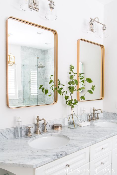 Are you hesitant to use mixed metal bathroom fixtures in your home? Mixing metals is becoming more and more popular in interior home decor, and there's no better place to experiment with this design trend than in a bathroom: Hardware, plumbing fixtures, and lighting all provide beautiful opportunities to mix metals. #bathroomdesign #hardware #modernfarmhouse Mixed Metal Bathroom Fixtures, Mixed Metal Bathroom, Polished Nickel Bathroom Faucet, Transitional Decor Bathroom, Black And Gold Bathroom, Glass Shower Doors Frameless, Nickel Bathroom, Mixing Metals, Led Wand