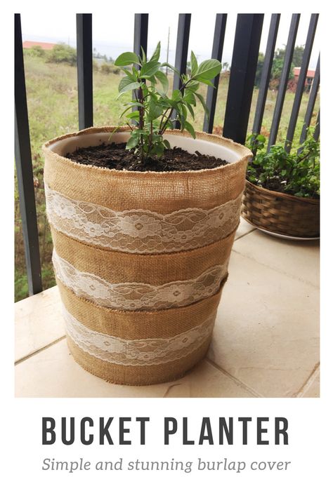 Turn a 5 gallon bucket into a planter for your potted garden. It's as simple as wrapping pieces of this burlap table lining from Target around and stapling into place.  | poke drainage holes with a hammer and nail, add rocks for extra drainage, the potting soil and plant! I planted Thai Basil in mine :) Bucket Planter Ideas, Indoor Planter Decor, Bucket Garden, Paper Flower Centerpieces, Potted Garden, Planter Cover, 5 Gallon Buckets, Bucket Ideas, Bucket Planters