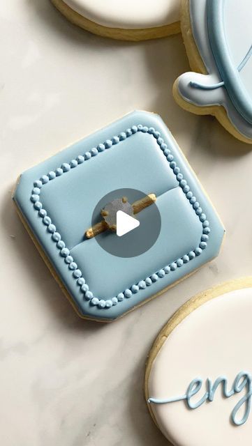 Ronnie’s Custom Cookies on Instagram: "Okay but is your diamond engagement ring edible though?! . . . . . . #cookies #cookier #cookiesofinstagram #cookiedecorating #cookiedecorator #decoratedcookies #cookievideo #cookiereels #cookiereel #cookiedecoratingvideo #cookiedecoratingvideos #engagementringcookies #ringcookies #isomaltsugar #isomalt #isomaltgems #columbusohio #columbuscookies #cookiesofcolumbus #columbusbakery #engagementcookies #weddingcookies" Easy Circle Cookie Designs, Ring Box Cookie, Ring Box Cookies Decorated, Diamond Ring Cookies, Engagement Decorated Cookies, Engagement Party Cookies Decorated, Engagement Ring Cookies Decorated, Engagement Sugar Cookies Decorated, Anniversary Decorated Cookies