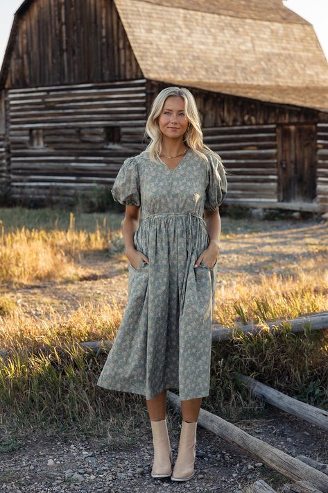 Featuring a v-neckline, waist tie, and pockets, the Our Song Puff Sleeve Dress has the cutest floral pattern that will have you standing out in a crowd. Pair with boots this Fall but keep this dress around come Springtime! back zipper closure with hook + eye unlined pockets // paired with the free people essential chelsea boots in antiquewhite + the something new pointelle cardigan Prairie Style Dress Outfit, Fall/winter Dresses, Spring Short Sleeve Prairie Dress, Homestead Fashion, Cute Fall Dresses, Summer Floral Print Prairie Dress With Puff Sleeves, Feminine Long-sleeve Prairie Dress For Summer, Fall Feminine Outfits, Cottagecore Prairie Dress With Puff Sleeves