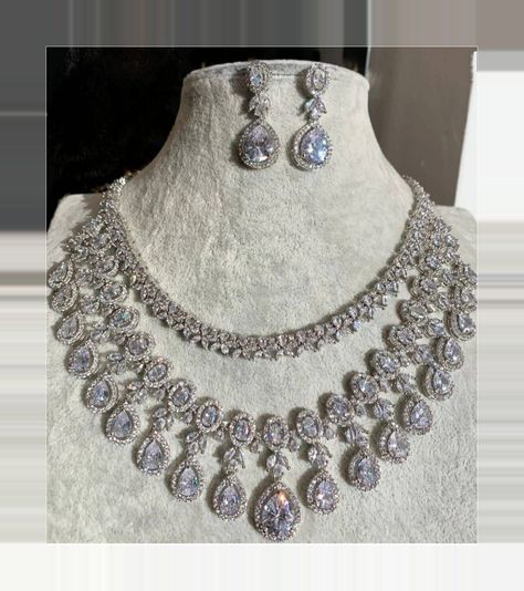 [SponsoredPost] Very Pretty And Gorgeous Cz Necklace With Matching Earrings And 51 K White Gold Plating. Aaa Korean Cz Stones Used Delicate And Elegant Necklace Length- 51 Inches Earrings Length- 1.5 Inches Earrings Weight- 8 Grams Per Earring. These Are Lightweight Necklace Has Adjustable Chain. Earrings Have Pushbacks Highest Quality And Craftsmanship Customized Orders Takes 8 To 8 Weeks, Depending On Piece Requirements. The Ombre Designs Jewelry Pieces Can #bridalstatementnecklace Luxury White Cutdana Necklaces, Luxury Silver Temple Necklace For Reception, Luxury Necklace With Intricate Design In Diamond White, Luxury Diamond Cut Necklace With Synthetic Diamond, Luxury Diamond White Stone Jewelry, Luxury Gold Plated Diamond White Jewelry, Luxury Elegant Bridal Necklace With Diamond Accents, Luxury Diamante Diamond White Jewelry, Luxury Pave Setting Necklace For Wedding