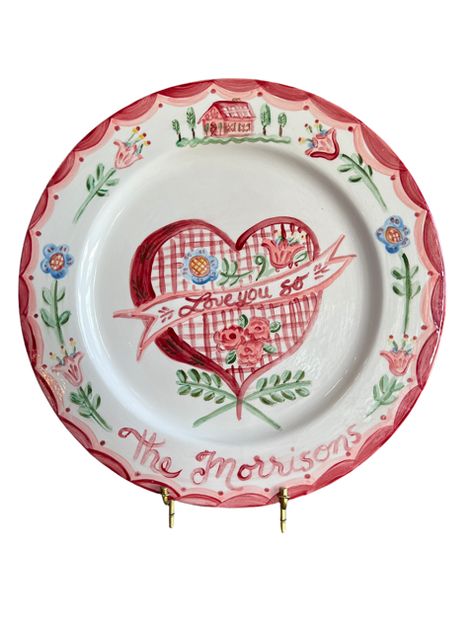 Self-taught artist Tricia Lowenfield crafts one-of-a-kind whimsical pieces that enliven any household and will become family treasures. Entirely handmade, the Love You So Platter can deliver a personalized Valentine's message to those you love. Makes a delightful gift, or the ideal platter from which to serve that special Valentine's Day Dinner. Yum! Product Details Handpainted ceramic. Handmade in the USA. Care Details Dishwasher safe. Hand wash recommended. Size & Fit 13" DIA Shipping Details Whimsical Plates, Ceramic Store, Painted Ceramic Plates, Valentine Messages, Valentines Day Dinner, Wedding Plates, Painted Plates, Ceramic Handmade, Hand Painted Plates