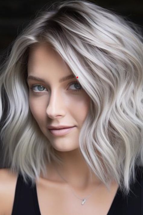 Platinum ash blonde with silver highlights is your go-to for a radiant, eye-catching look. The silver highlights add a sparkling touch to the cool ash blonde, creating a multidimensional effect. This style is ideal for those who love to stand out and works well with both straight and wavy textures. Click here to check out more trending ash blonde hair color ideas you need to try. Light Ash Blonde Hair Color, Greyish Blonde Hair, Ash Blonde Hair Color Ideas, Ash Blonde Short Hair, Icy Blonde Hair Color, Ash Blonde Hair Color, Light Ash Blonde Hair, Silver Hair Highlights, Gray Hair Color Ideas