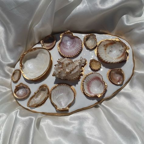 XL shell jewelry tray out now! Link in bio for anyone interested✨🫶 #shell #shelljewelry #shellart #bridesmaidsgifts #bridesmaidsgift #bridesmaidsgiftsidea #coastal #coastalhome #coastaldecor #seashell #seashelljewelry #seashellart #jewelrytrends #jewelrytray #etsy #etsyshop #smallbusiness #bridaljewellery #bridalgifts Seashells Decorations, Jewelry Tray Clay, Seashell Tray, Rock Vase, Tray Clay, Oyster Shell Jewelry, Iridescent Paint, Shell Vase, Bake Clay