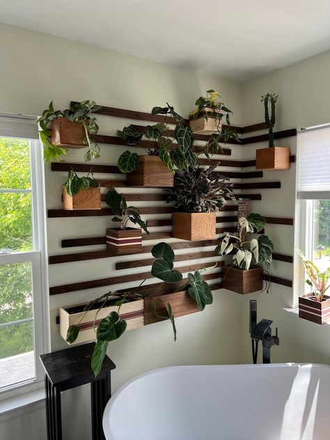 This is a fully customizable solid walnut French cleat wall. The walnut hardwood allows for exceptional strength that can hold plants and self-watering planters up to 40 lbs per box. The boxes can be picked up and moved around the wall with ease. All mounting hardware will be included along with spacers for an easy installation. The boxes will have cleats pre-installed. The boxes and the walnut French cleats are finished with a waterproof finish in either of the following: Satin Semi-Gloss (as p Corner Plant Wall Shelf, Plant Shelf Wall Ideas, Wall Plant Stands Indoor, Wall Shelves With Plants, Small Nook Decor, Indoor Garden House Design, Plant Wall In Office, Plants Home Office, Gallery Wall Plants