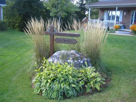 Need to do something like this at end of driveway around the rocks. Large Yard Landscaping, Driveway Entrance Landscaping, Driveway Landscaping, Landscaping Inspiration, Front Landscaping, Garden Yard Ideas, Landscaping Tips, House Landscape, Garden Photos