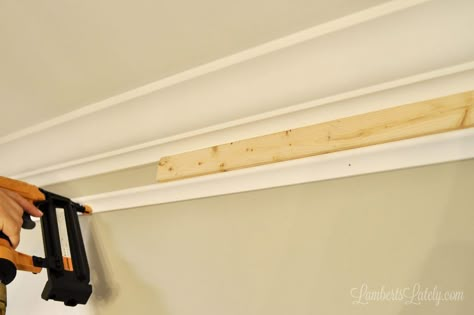 Check out this easy DIY for making existing crown molding look thick! Simply installing additional trim molding and using a faux painting trick makes simple molding look expensive. Diy Crown Moulding Ceilings, Built Up Crown Molding, Fake Crown Molding Diy, Crown Molding Hacks, Cheap Crown Molding Ideas, Diy Ceiling Trim, Crown Molding Alternatives, Crown Molding To Make Ceiling Look Higher, Faux Crown Molding With Paint