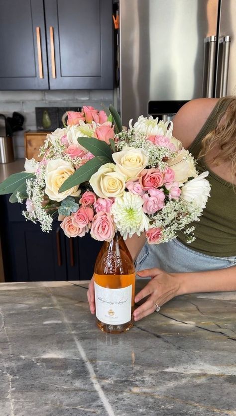 Easy gift idea💜 | Rick Lax, gift, wine bottle, video recording | Easy gift idea💜 Justine makes a beautiful floral arrangement using a wine bottle as the base. This original video was produced by Network Media, Rick... | By Allie and Friends Wine Bottle Flowers, Easy Gift Idea, Flowers Wine, Flower Bottle, Wine Mom, Diy Arrangements, Wine Bottle Gift, What Are We, For My Mom