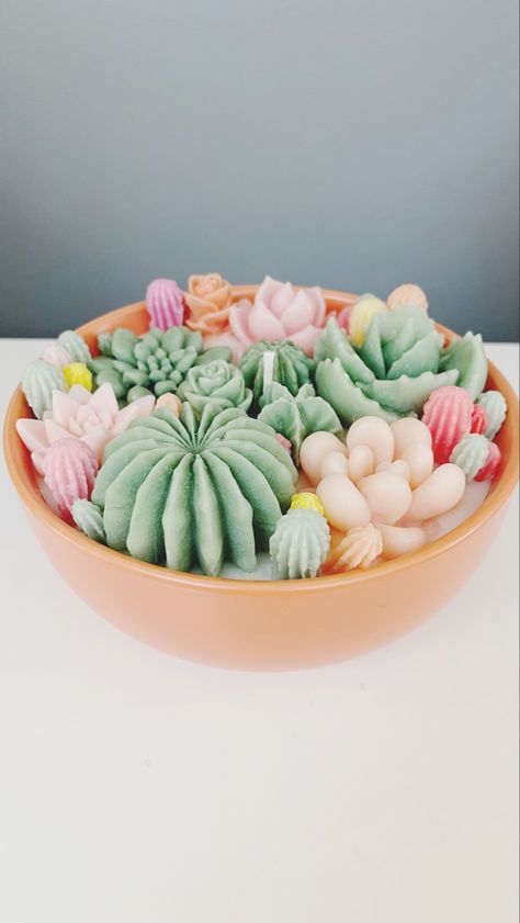 This Succulent Candle is the perfect way to add a unique and decorative touch to your home. It features a one-of-a-kind design with a variety of colourful succulents and plants, creating a beautiful and eye-catching centerpiece. This candle is sure to be a conversation starter, and it's also a great way to bring a bit of nature indoors. Enjoy the unique and beautiful design of this succulent candle! Colourful Succulents, Bougie Diy, Succulent Candle Centerpiece, Suculentas Candles, Diy Bougie, Succulent Candle Favors, Succulent Candles, Plant Candle, Cactus Blossom Candle