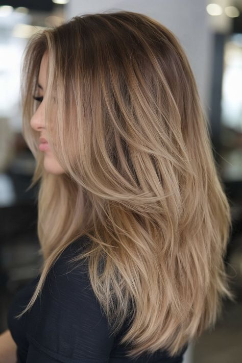 If you’re torn between blonde and brunette, this dimensional bronde balayage is the perfect balance. This spring balayage blonde idea for 2025 combines warm caramel and golden blonde hues with a shadow root for a seamless, low-maintenance grow-out. Blonde Balayage Brown Roots, Bronde Melt, Shadow Roots Hair Brunette, Brown Roots Blonde Hair Balayage, Lived In Blonde Balayage Dark Roots, Root Shadow Blonde, Low Maintenance Brunette Balayage Hair, Bronde Balayage Brunettes, Medium Blonde Balayage