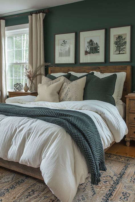 Ocean-inspired bedroom with deep sea green wall and white decor. Green Wall Farmhouse Bedroom, Guest Bedroom Navy Blue, Dark Green Master Bed Accent Wall, Emerald Green Accents Bedroom, Blue And White Bedroom Walls, Green Neutral Bedding, Dark Green Guest Room, Hunter Green Master Room, Modern Rustic Primary Bedroom