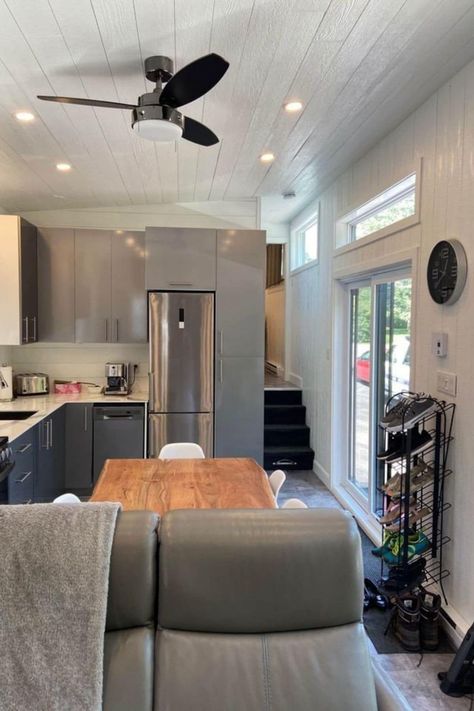 This 36' Four Seasons tiny home is a true mini mansion with a luxury kitchen, open floor plan, electric fireplace, and private bedroom! This tiny house one bedroom layout is a great choice for those who want to downsize but still keep luxury. One Bedroom Layout, Tiny House Fireplace, Kitchen Open Floor Plan, Mini Mansion, Mini Cabin, Cottage Tiny House, Private Bedroom, Tiny House Luxury, Tiny House Layout