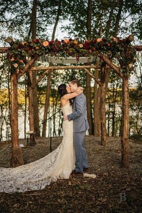 Couple under a wooden chuppah with fall flowers | Meadow Ridge on Hudson Coxsackie, NY Fall Chuppah, Flowers Meadow, Wedding Chuppah, New York Wedding Venues, Nyc Wedding Venues, Bridal Fair, Rustic Wedding Venues, Wedding Reception Locations, Affordable Wedding Venues