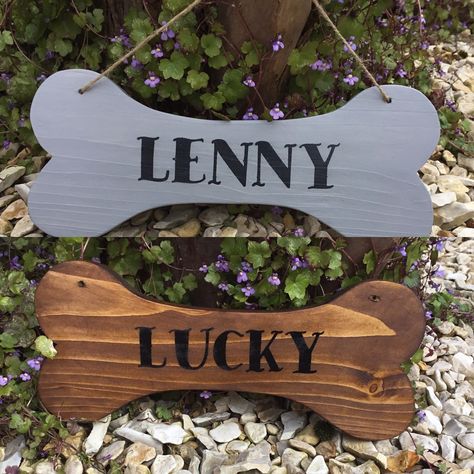 A wooden bone shape name sign which is personalised for your dog made from reclaimed wood and comes with jute string ready to hang over your dogs bed, kennel or bowls. Hand Painted in a choice of colours and 2 finishes indoor and outdoor.£7.50 available from www.dreamyhomes.co.uk Wooden Dog Bone Sign, Diy Dog Name Sign, Dog Name Signs Wooden, Masterclass Design, Dog Name Sign, Puppy Crafts, Dogs Bed, Puppy Palace, Puppy Kennel