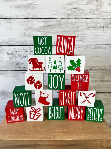 Christmas mini blocks are a fun and functional pieces to add to your tiered tray, hutch, shelves, and other small space this Holiday season. Measuring 1.75 inches each, each cube is painted your choice of color- red, green, or white. Choose from a variety of sayings to customize your cubes. Images are also available, but keep in mind these look best on white blocks due to the colored vinyl. Keep them together to make on long 'sign', stack them to add height, or use them as risers to lift up othe Unique Christmas Crafts, Tiered Tray Decor Christmas, Wood Sign Christmas, Christmas Tiered Tray Decor, Wood Christmas Decorations, Dollar Store Christmas Crafts, Tray Decor Christmas, Christmas Tiered Tray, Christmas Blocks