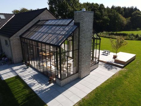 Orangery as an extension of living room - Drivadan Fireplace In Orangery, Green House Extension, Modern Glass Greenhouse, Rear Extension Ideas Semi Detached, Orangeries Extension, Glass House Extension, Modern Orangery Extension, Modern Orangery, Glass Room Extension