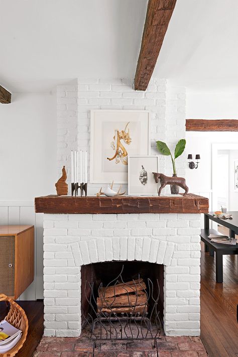 Nothing says cozy quite like a brick fireplace. Create a focal point in your home with our best brick fireplace design ideas. White Brick Fireplace Decor, Brick Fireplace Design, Brick Fireplace Ideas, Fireplace Design Ideas, Red Brick Fireplaces, White Brick Fireplace, Cottage Fireplace, Wooden Mantle, Painted Brick Fireplace