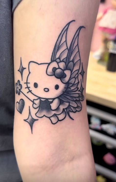 Hello Kitty Angel Tattoo, Cute Tattoos Hello Kitty, Hello Kitty And Mimi Tattoo, Fairy Hello Kitty, Hello Kitty Fairy Tattoo, Hello Kitty Tiny Tattoo, Hello Kitty Tattoo Ideas, Hello Kitty Tattoo, Simple Leg Tattoos