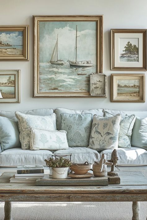 A captivating pin showcasing coastal vintage decor trends featuring weathered wood elements and soft blue accents. Explore how these choices can transform interior spaces into serene beach-inspired retreats. Vintage Coastal Living Room, Costal Interior Design Home, Vintage Coastal Aesthetic, Seashell Display Ideas, European Coastal Decor, Gallery Wall Decor Ideas, Coastal Shelf Decor, Beachy Artwork, Coastal Gallery Wall