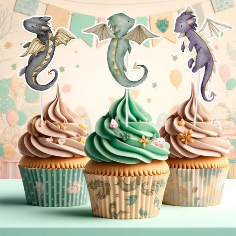 Enchanting Dragon Toppers: Elevate your cupcakes with our 10 pcs Dragon Cupcake Toppers, featuring mystical dragon designs.     Set of 10: Each package includes 10 captivating toppers, perfect for adding a touch of fantasy to your treats.     Premium Craftsmanship: Crafted from high-quality cardstock, these toppers are durable and vivid, making your cupcakes truly stand out.     Effortless Application: Simply insert them into cupcakes, muffins, or other desserts for instant fantasy-themed decor.     Versatile for All Occasions: Ideal for birthdays, fantasy-themed events, and dragon enthusiasts of all ages.     Fun for All Ages: Safe for everyone, these toppers are loved by kids and adults who appreciate the magic of dragons.     Create Magical Memories: Add a touch of enchantment to your c Dragon Smash Cake, Dragon Cupcake Toppers, Dragon Cupcakes, Dragon Birthday Party, Shower Vibes, Dragon Baby Shower, Mystical Dragon, Magical Dragon, Green Cupcakes